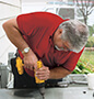 Man installing AC unit